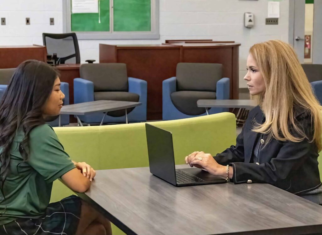 Lead consultant, Amy meeting with a High School student for college admissions